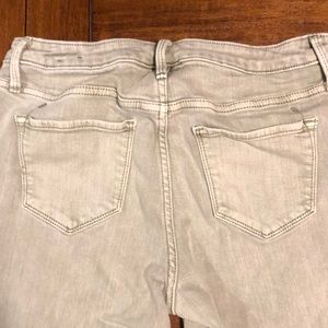 Faint green pants with fringe on the edges